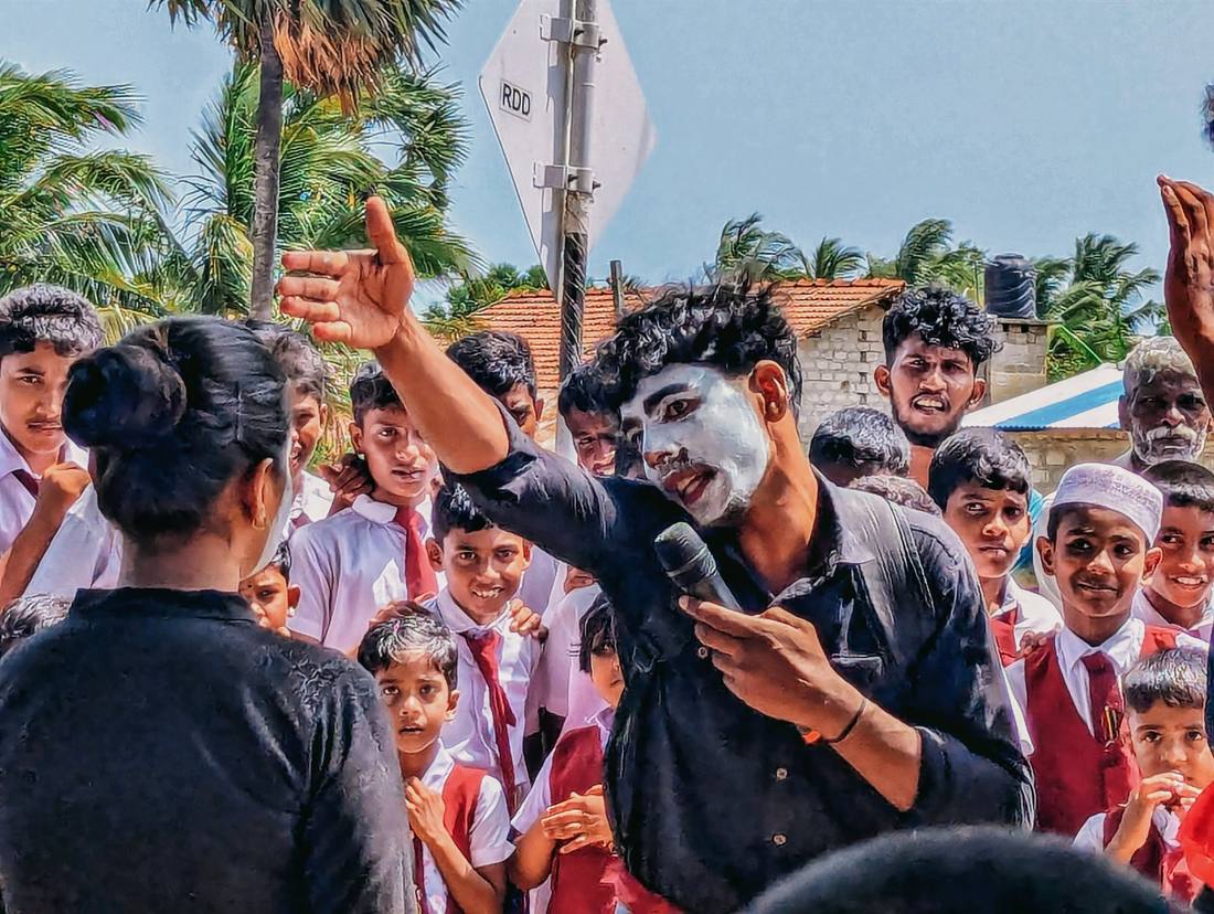 Performer engaging with the crowd during the street drama