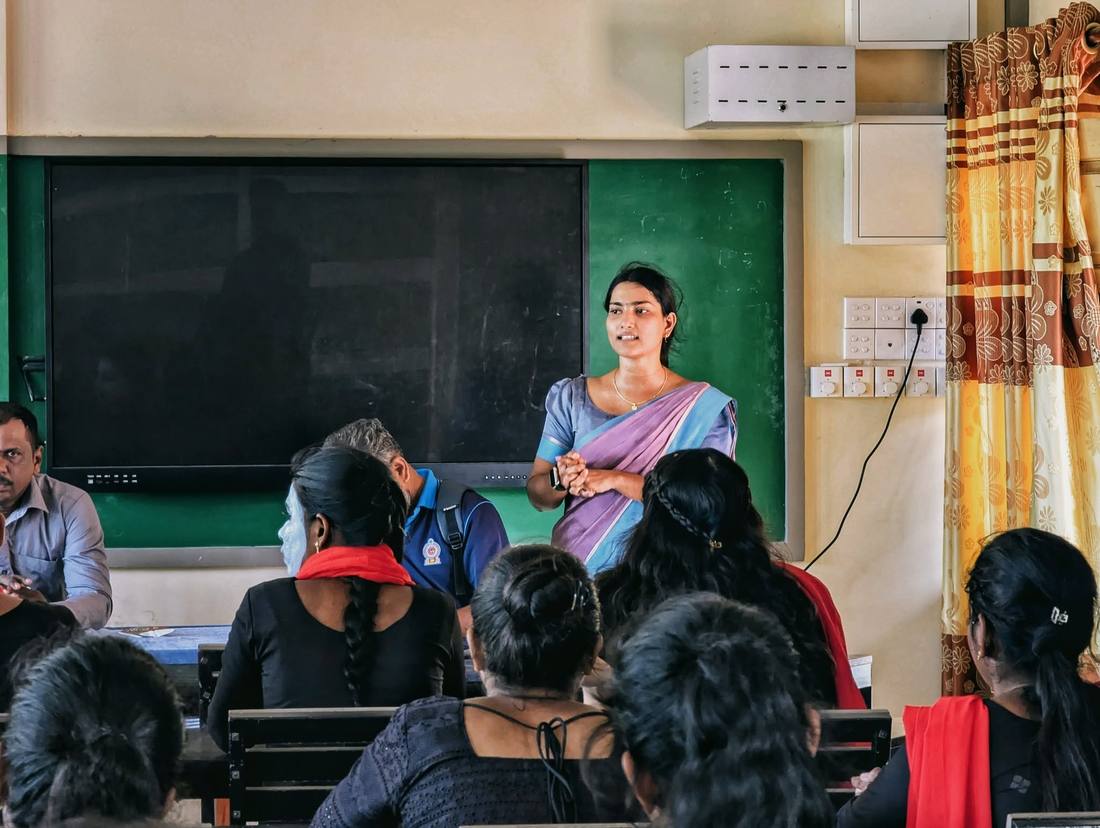 Facilitator speaking to students in a classroom session