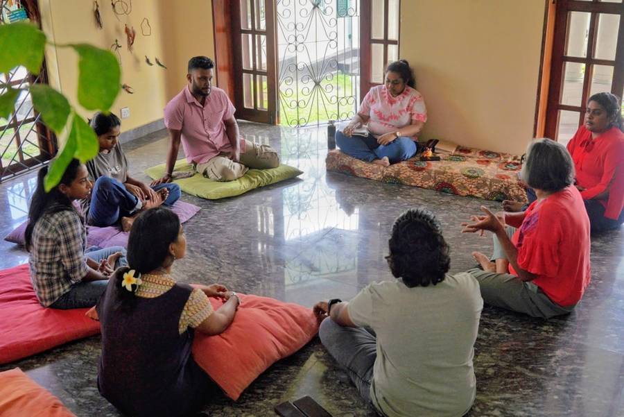 Cohesion Circle participants seated in a circle indoors