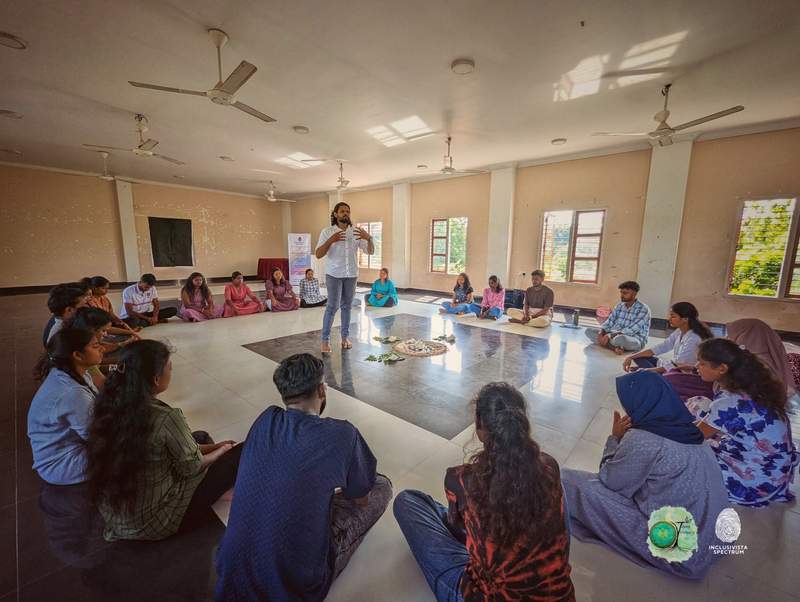 Facilitator leading a reflective session in a circle