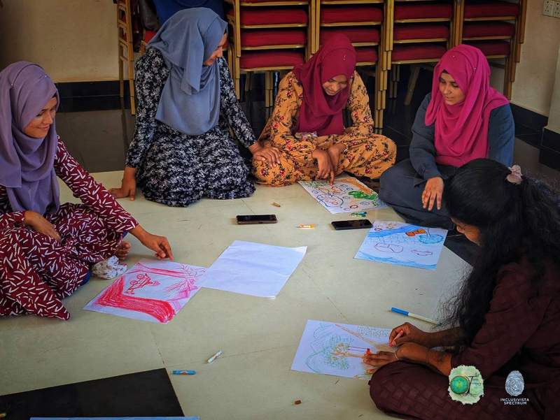 Participants drawing together during the workshop